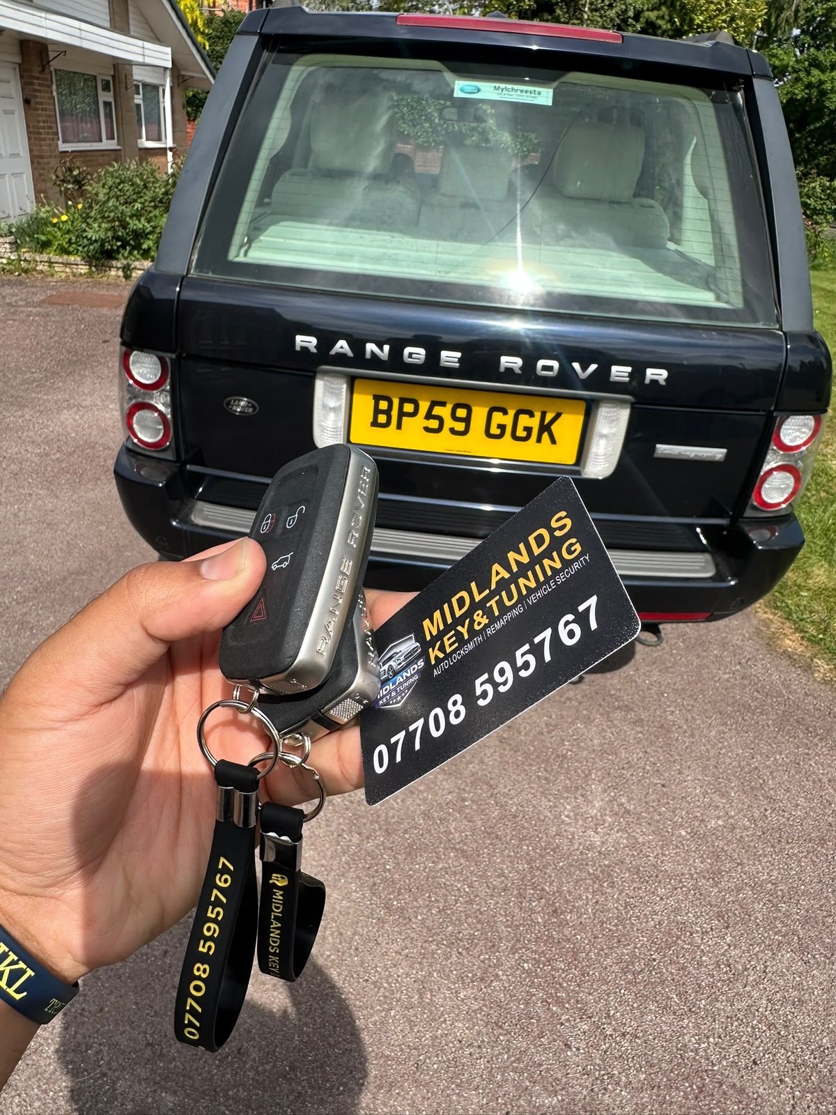 Auto locksmith working on a vehicle